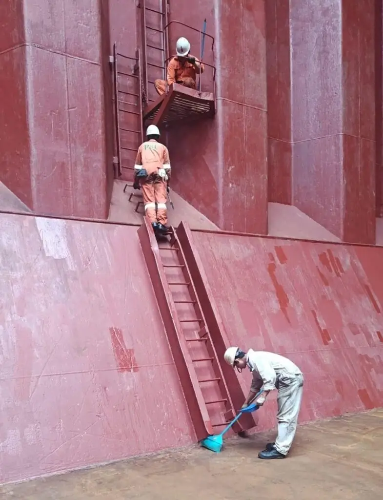 UPRIVER Marine surveyors inspecting a cargo hold from the access ladder