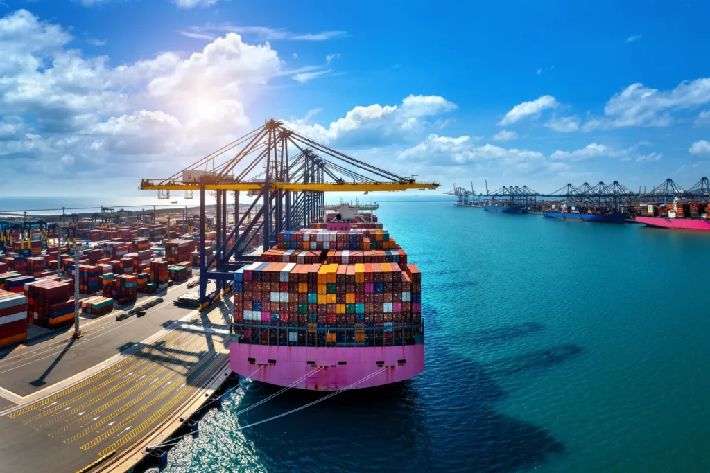 Aerial view of a cargo ship and containers in a harbour