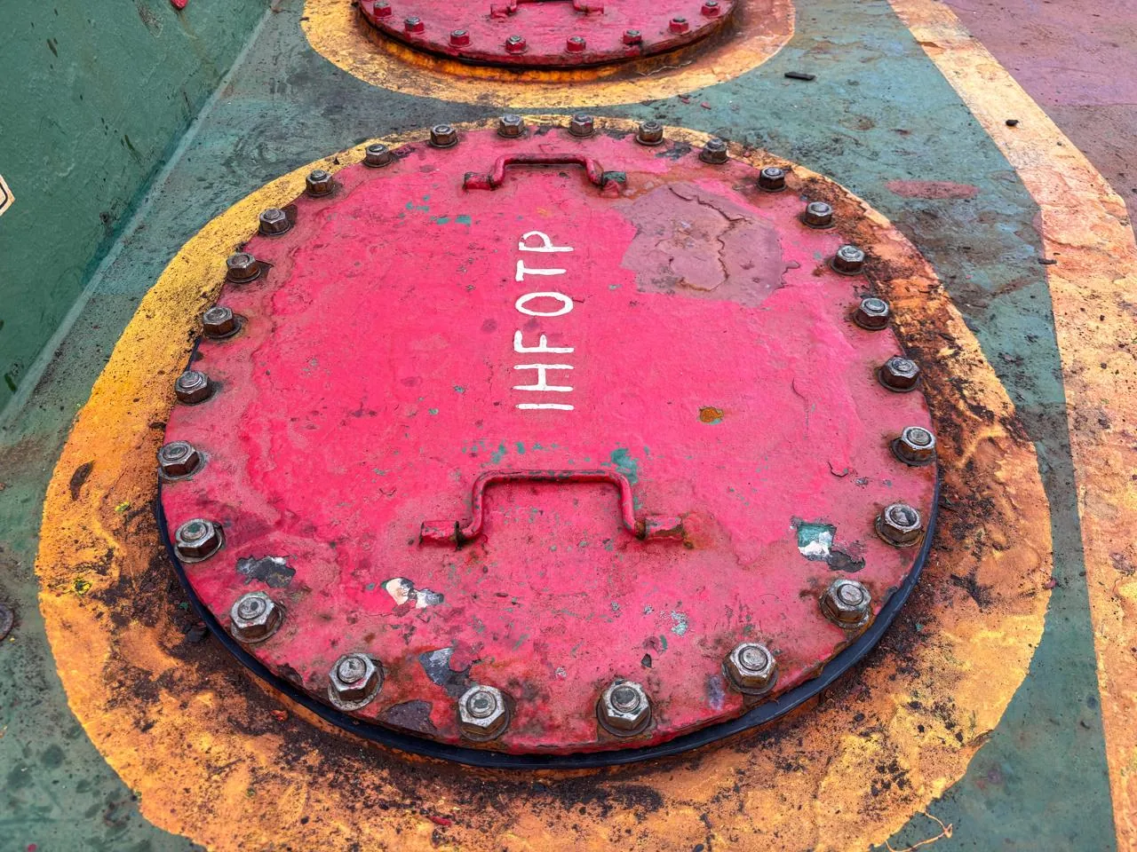 Manhole cover of the HFO tank 1P opened for a direct sounding during the re-survey at berth