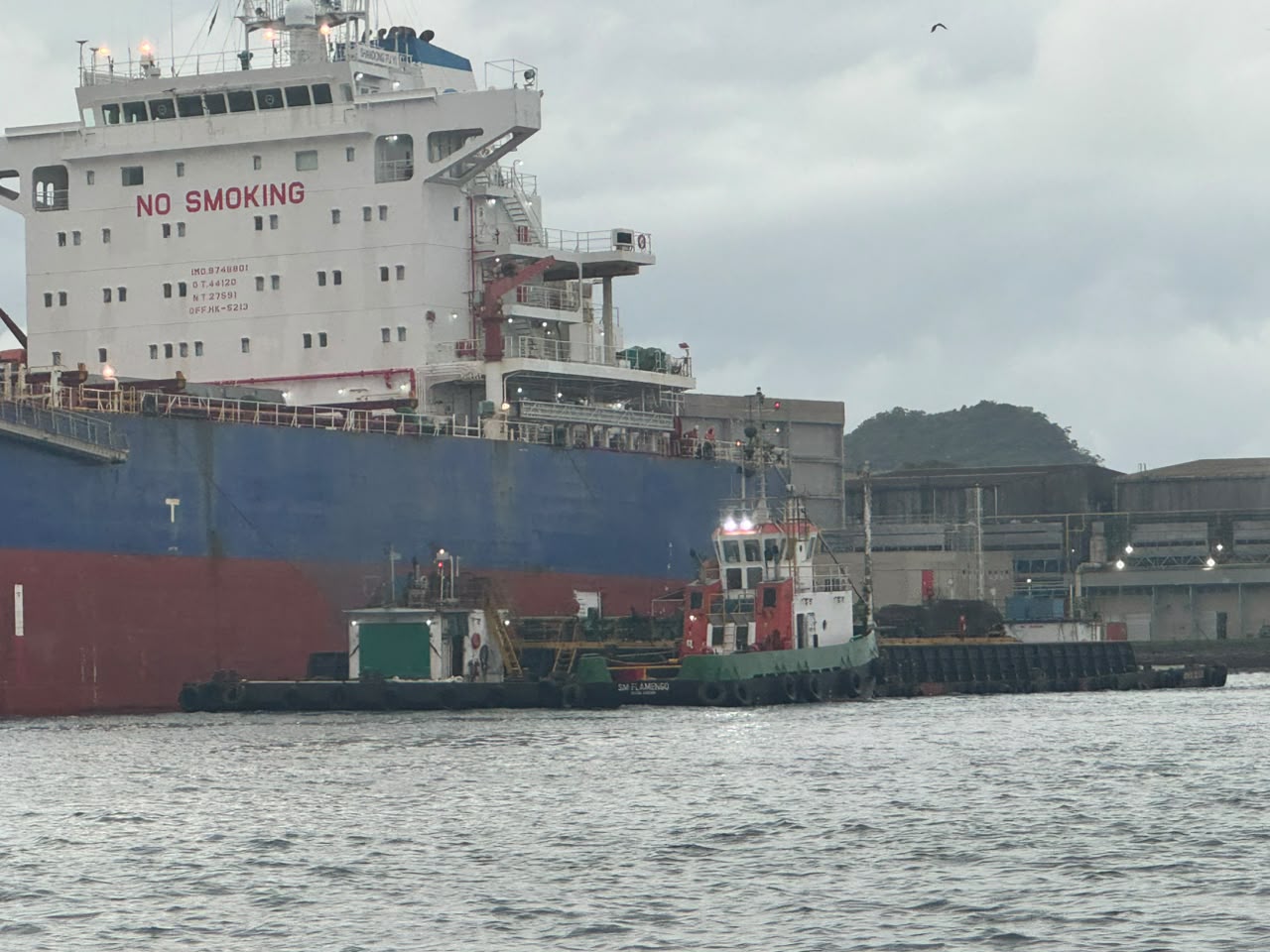 Tanker with bunker barge alongside at berth